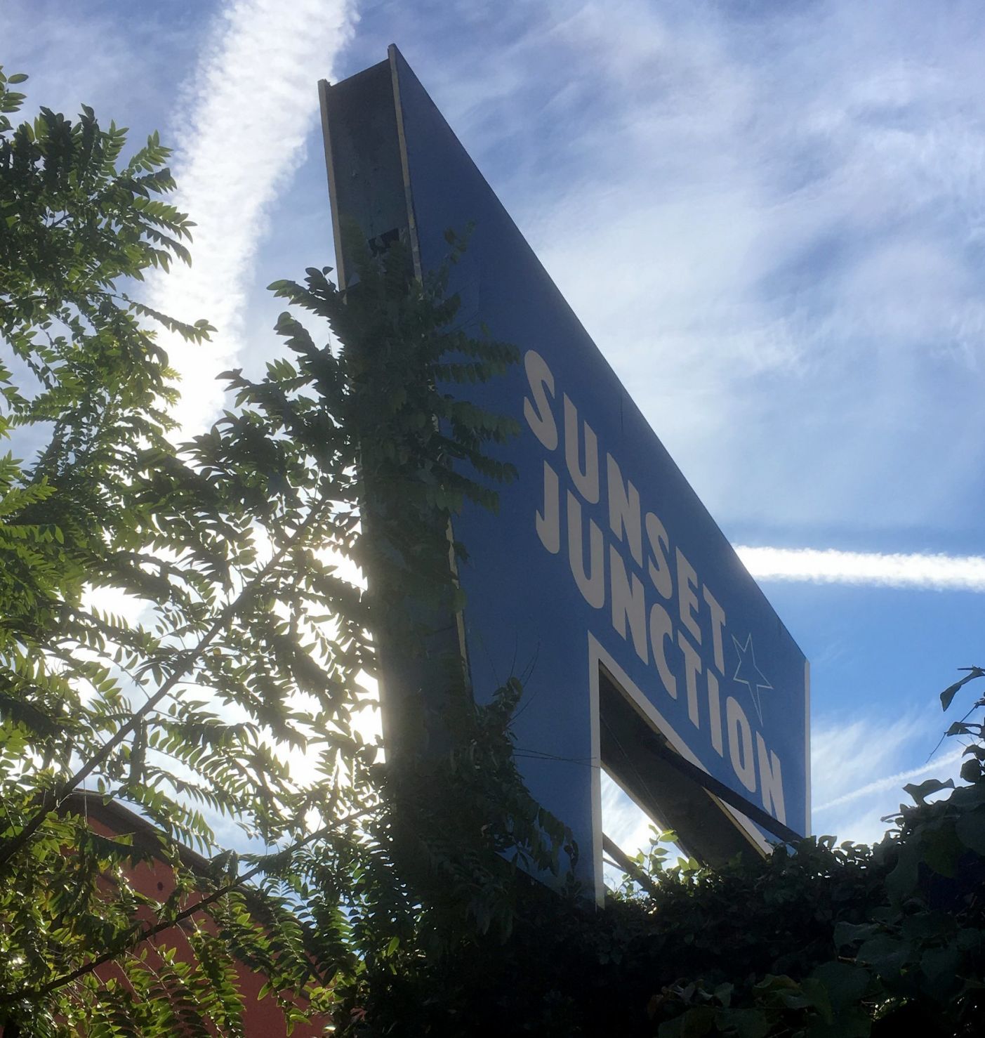Partially repainted Sunset Junction sign